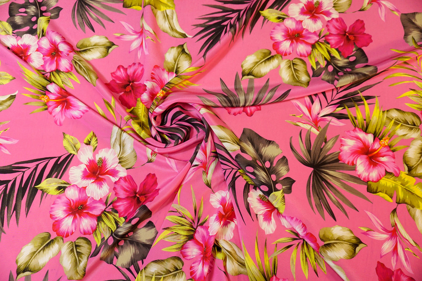 Silk crepe, tropical luxury on a fuchsia background