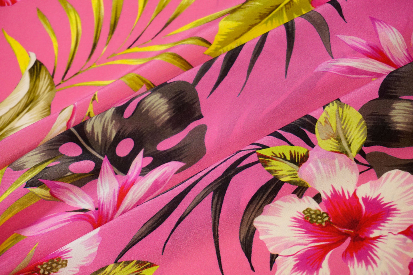 Silk crepe, tropical luxury on a fuchsia background