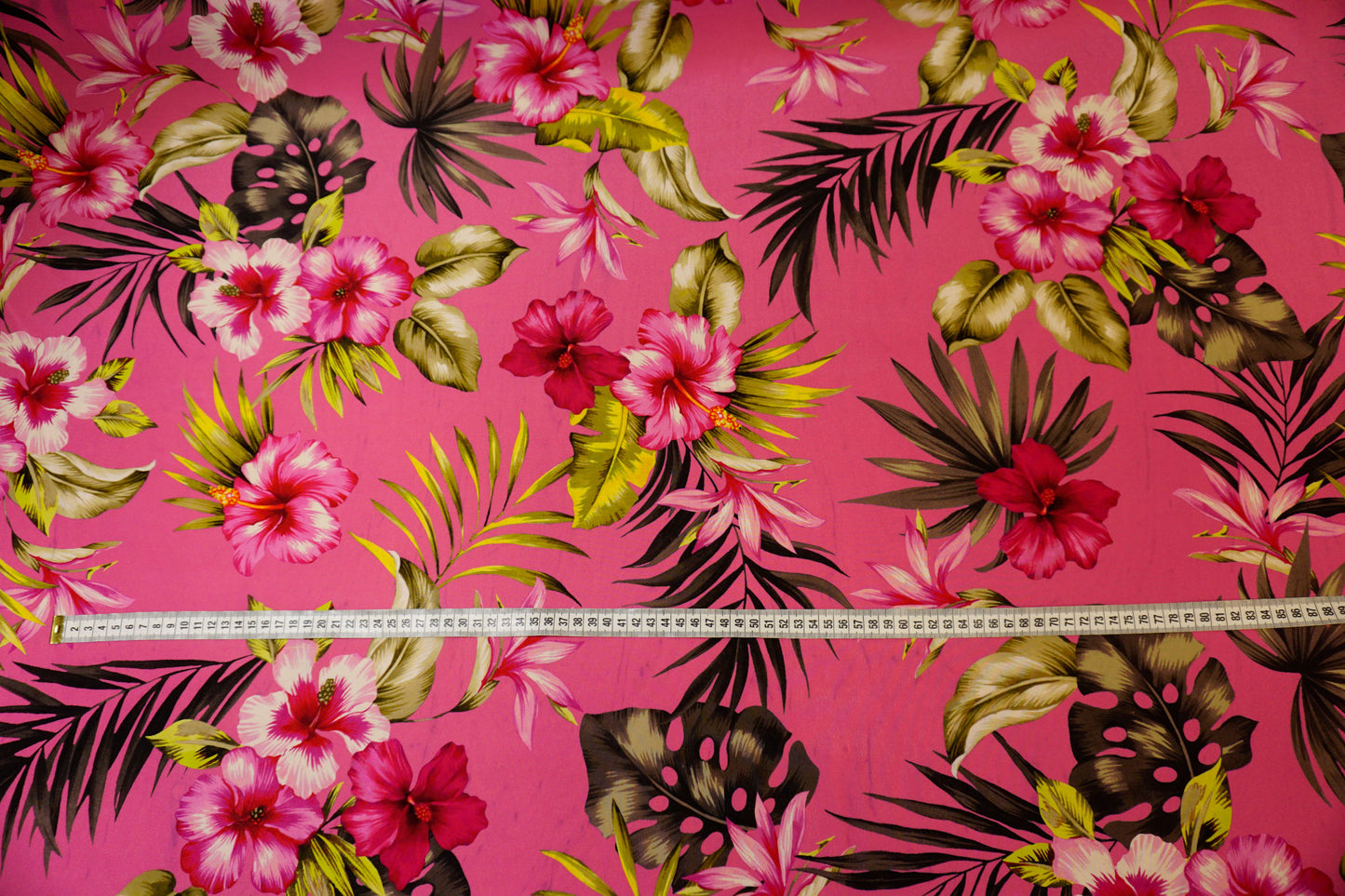 Silk crepe, tropical luxury on a fuchsia background