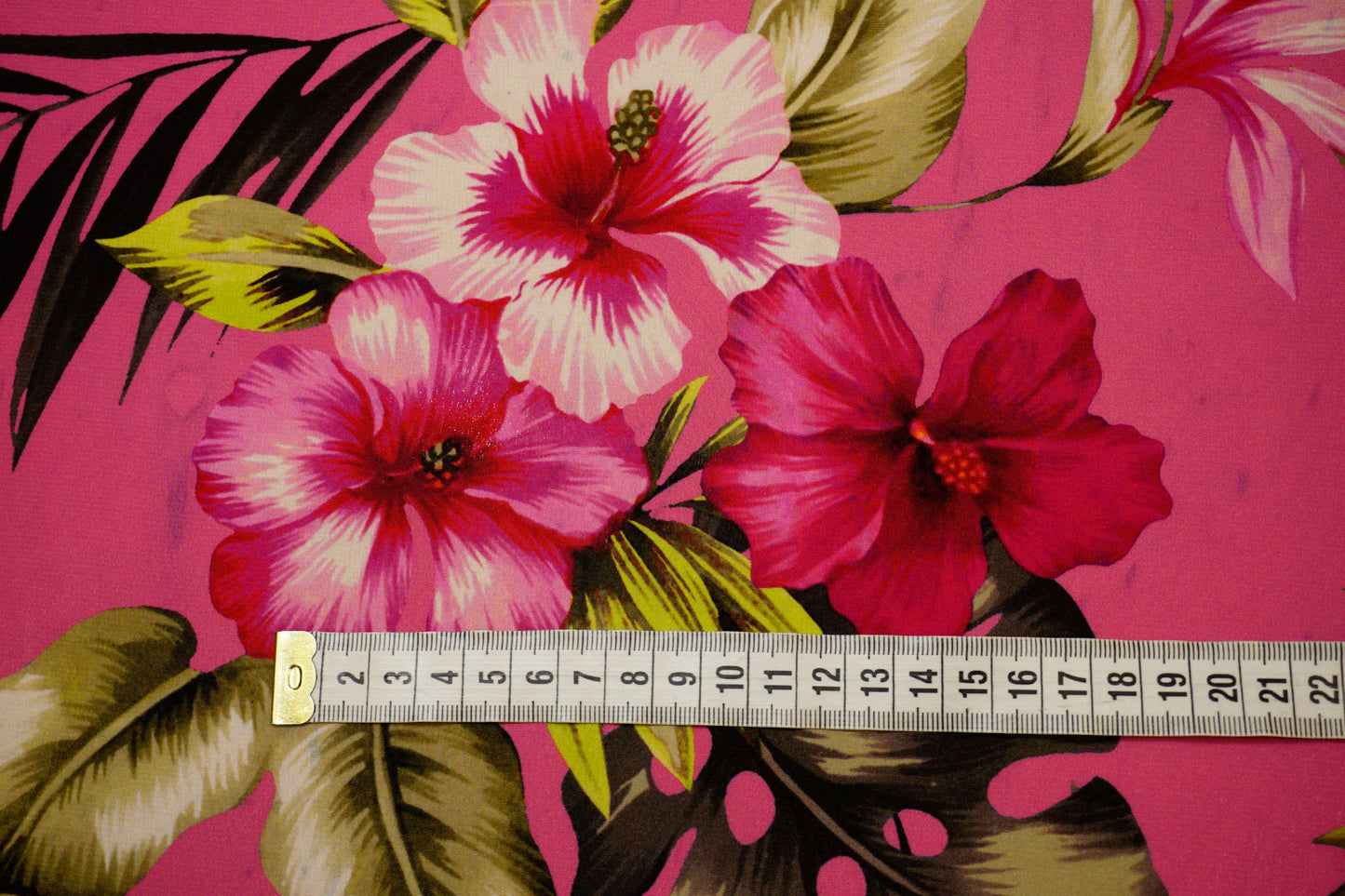 Silk crepe, tropical luxury on a fuchsia background