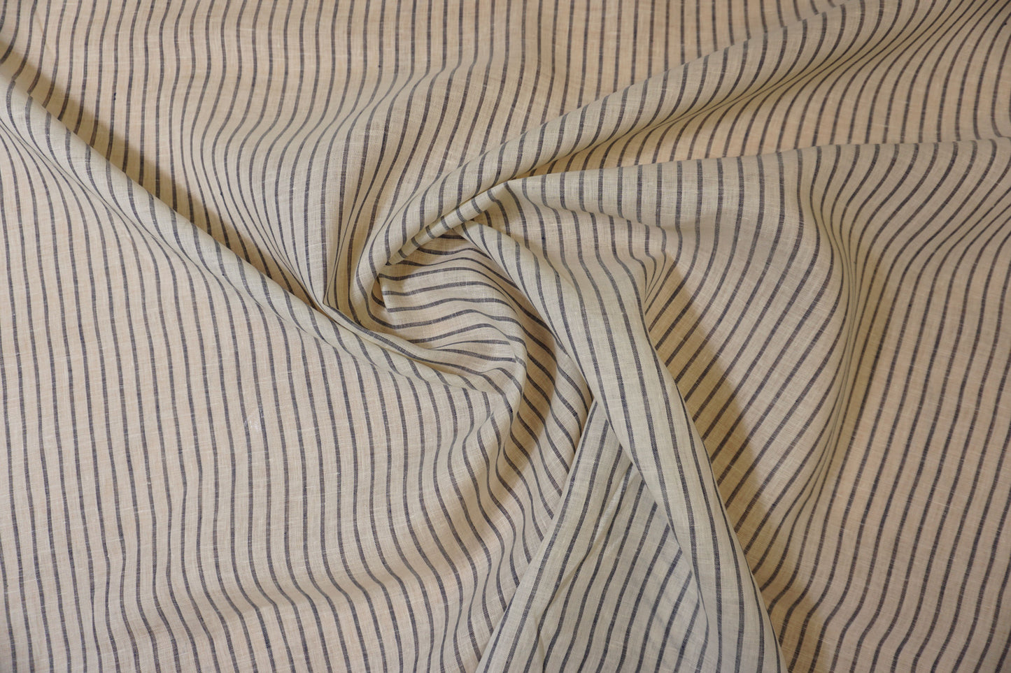 Fine linen fabric in white with denim blue stripes