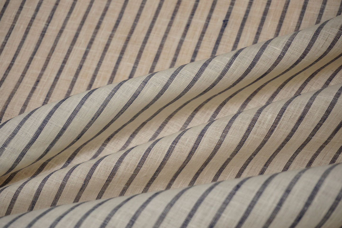 Fine linen fabric in white with denim blue stripes