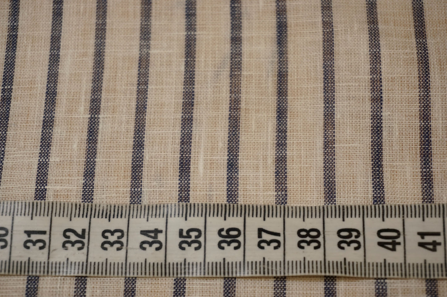 Fine linen fabric in white with denim blue stripes
