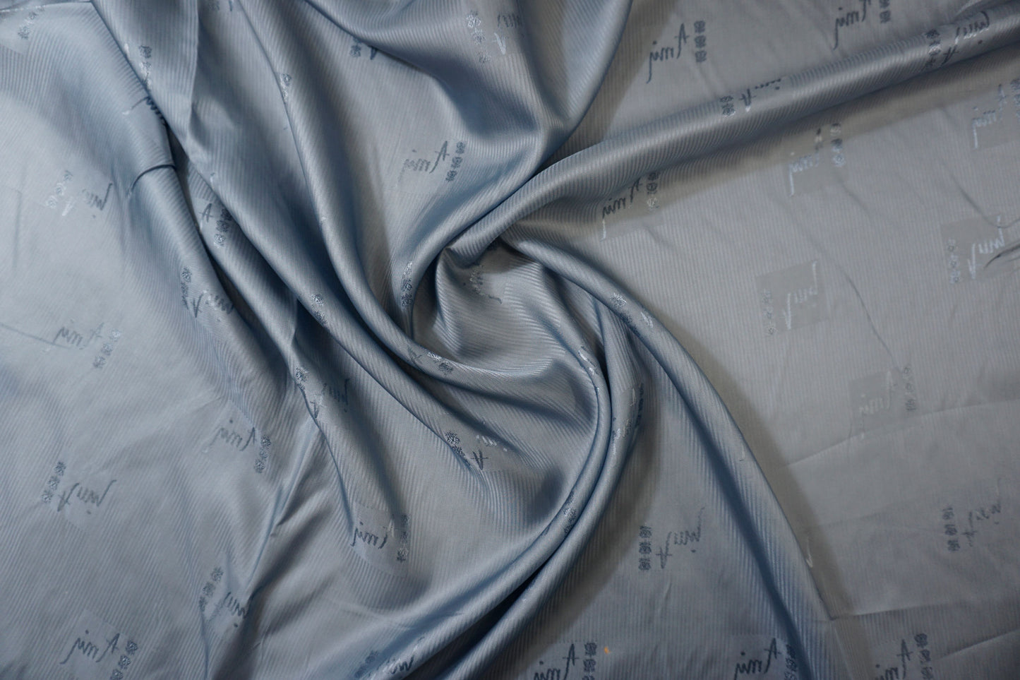 Lining fabric with subtle lettering