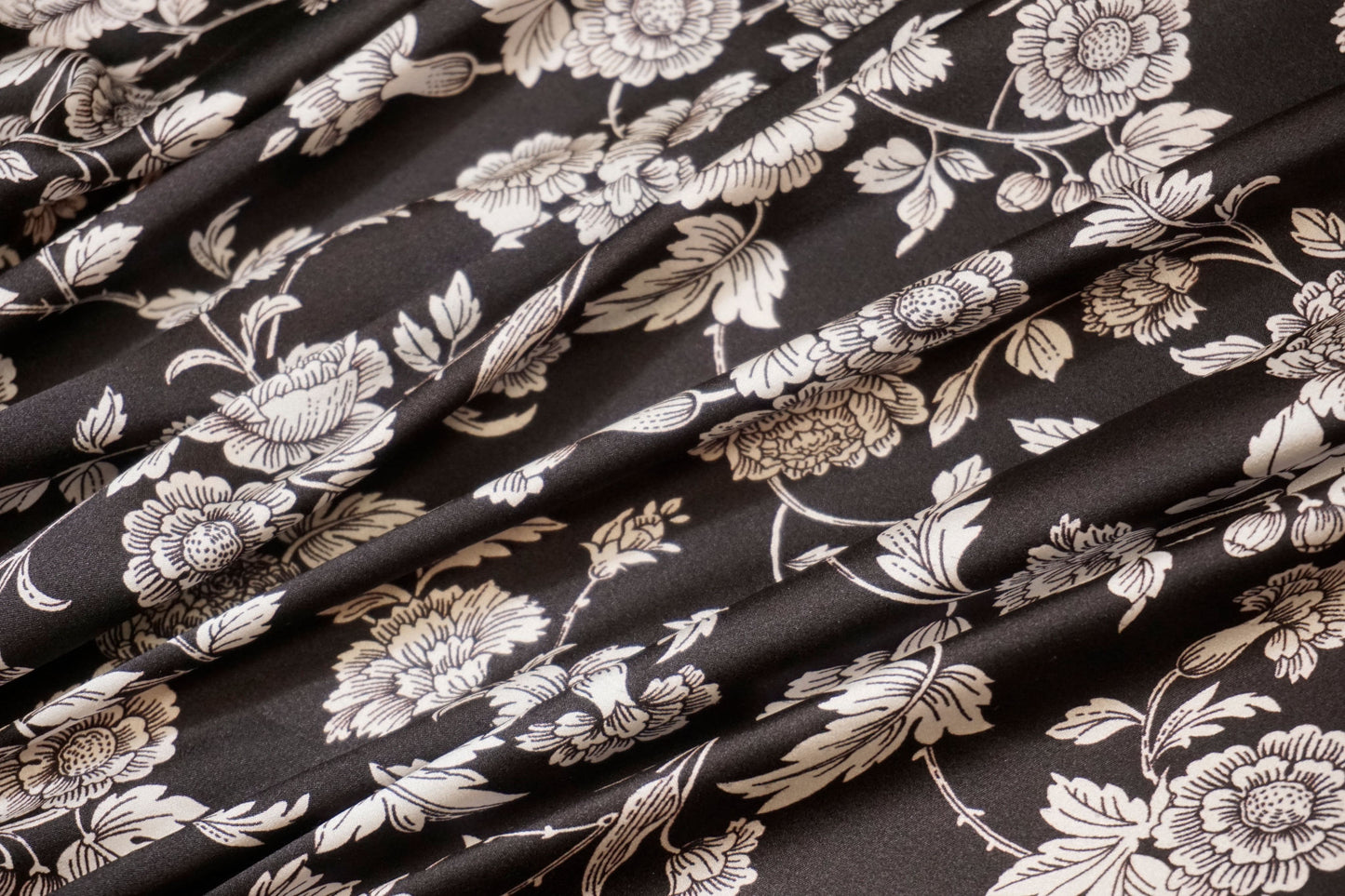 Silk stretch with floral sketches on black