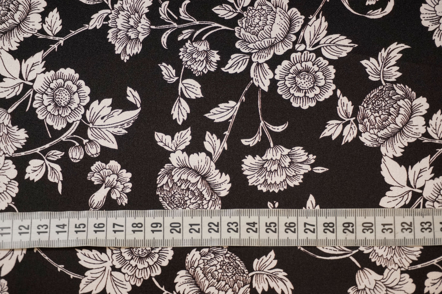 Silk stretch with floral sketches on black