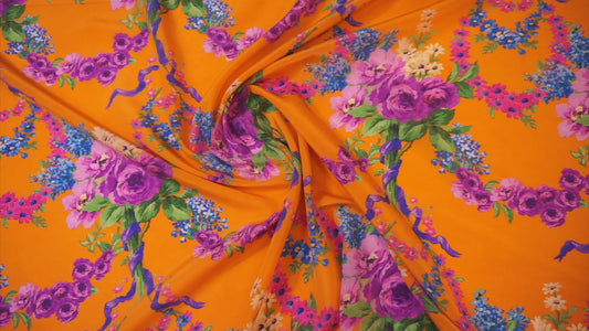 Silk crepe – bright orange with a magical floral print
