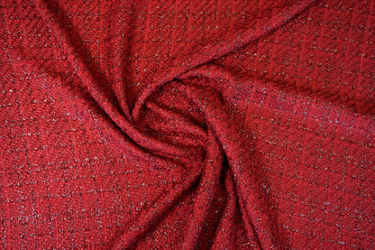 Ausdrucksstarker Bouclé-Stoff in intensivem Rubinrot mit edlem Lurex-Schimmer