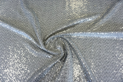 Exklusiver Chevron-Mantelstoff – Fischgrät-Optik mit Pailletten-Glow