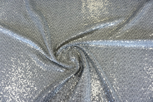 Exklusiver Chevron-Mantelstoff – Fischgrät-Optik mit Pailletten-Glow