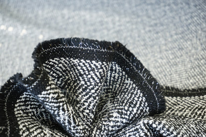 Exklusiver Chevron-Mantelstoff – Fischgrät-Optik mit Pailletten-Glow