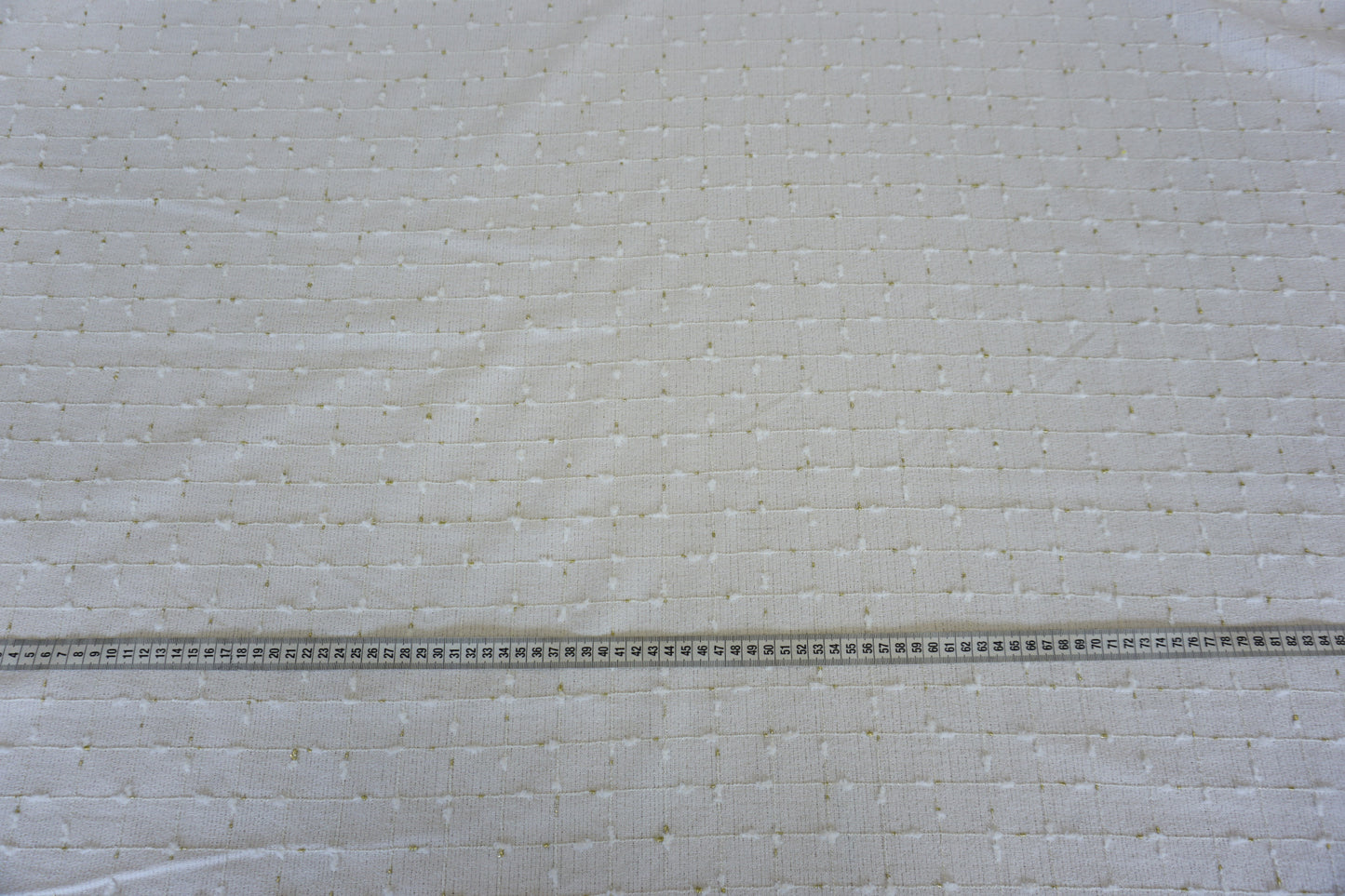 Exclusive Bouclé in White & Gold – Geometric Elegance
