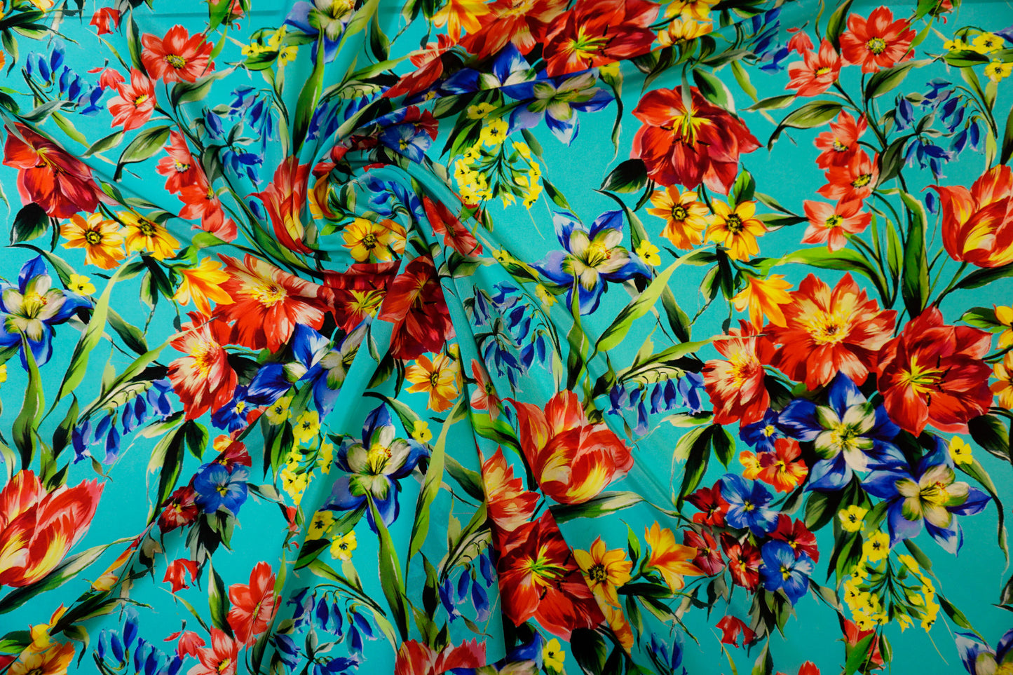Silk crepe – floral print in bold colors on blue-turquoise