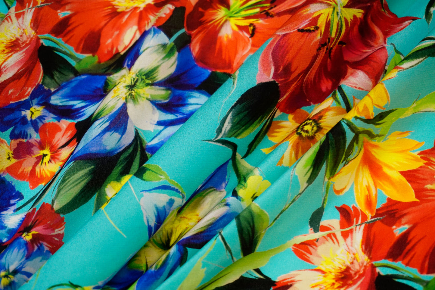 Silk crepe – floral print in bold colors on blue-turquoise