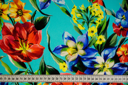 Silk crepe – floral print in bold colors on blue-turquoise